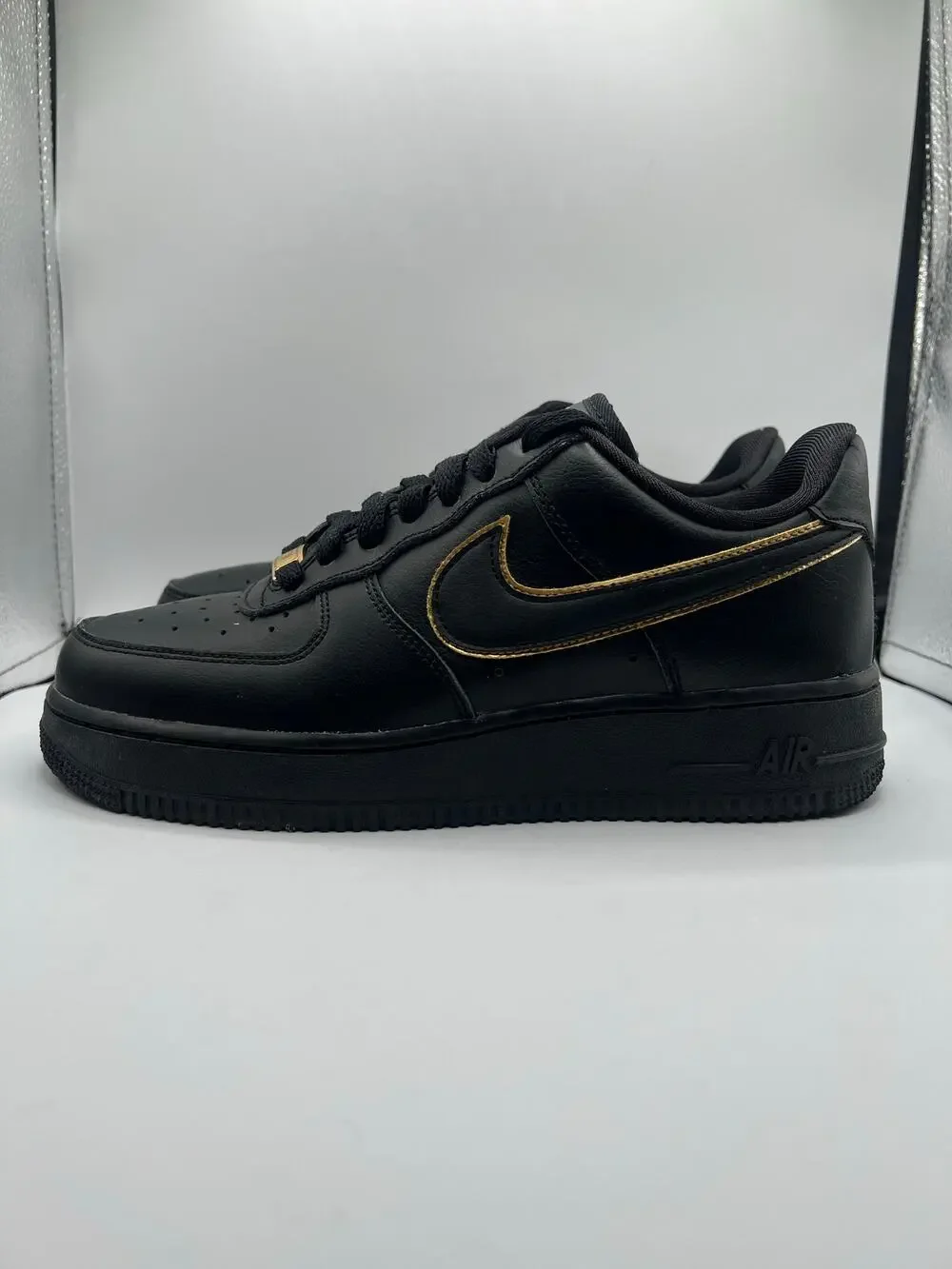 Nike Air Force 1 Low ‘07 Essential “Black Gold Swoosh” size 7.5 women’s used